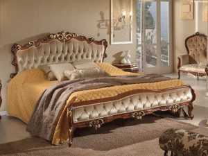 Двуспальная кровать из ткани с капитонным изголовьем